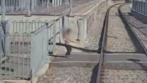 Toddler’s near-miss at train station caught on camera