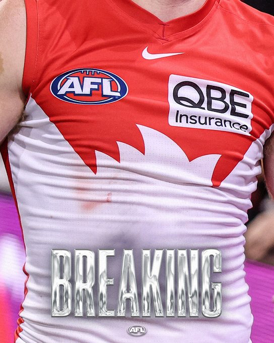 Close-up of a red and white AFL jersey with AFL and QBE Insurance logos and a large 'BREAKING' watermark across the chest.