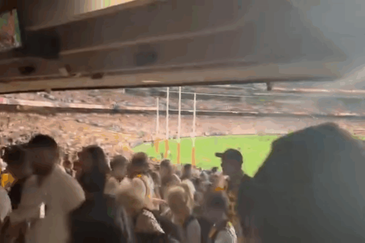Angry Hawthorn fan throws plate of nachos at mother and eight-year-old son